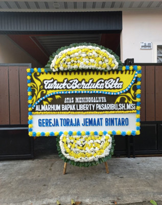 Papan Bunga Duka di Wonti